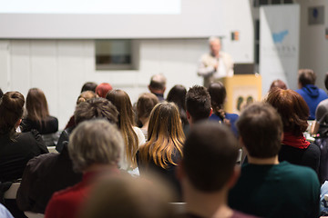 Image showing Man giving presentation in lecture hall at university.