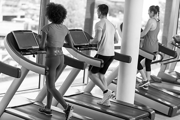 Image showing people exercisinng a cardio on treadmill