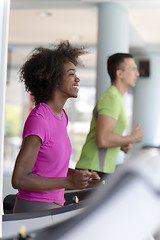 Image showing people exercisinng a cardio on treadmill