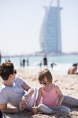 Image showing Mom and daughter on the beach