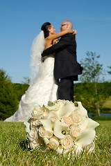 Image showing Wedding bouquet and couple