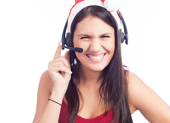 Image showing Pretty phone operator in Santa hat isolated over white