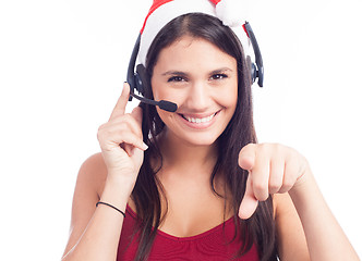 Image showing Pretty phone operator in Santa hat isolated over white