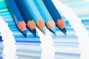 Image showing blue colored pencils and color chart of all colors