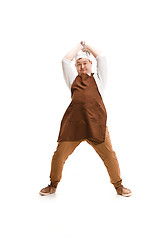 Image showing Angry aggressive butcher posing with a cleaver isolated on white background