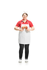 Image showing Portrait of cute smiling woman with pastries in her hands in the studio, isolated on white background