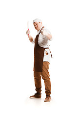 Image showing Smiling butcher posing with a cleaver isolated on white background