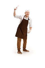 Image showing Smiling butcher posing with a cleaver isolated on white background