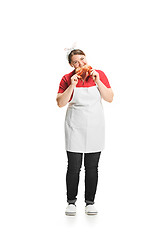 Image showing Portrait of cute smiling woman with pastries in her hands in the studio, isolated on white background