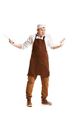 Image showing Smiling butcher posing with a cleaver isolated on white background