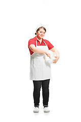 Image showing Portrait of cute smiling woman with bowl in her hands in the studio, isolated on white background