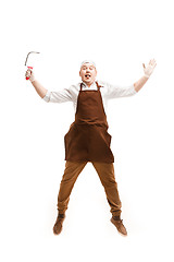 Image showing Smiling butcher posing with a cleaver isolated on white background