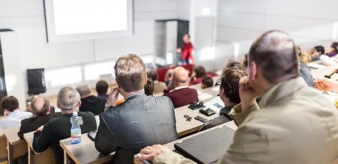 Image showing Business speaker giving a talk at business conference event.