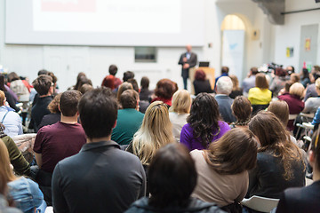 Image showing Man giving presentation in lecture hall at university.