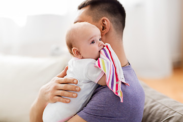 Image showing father with little baby girl at home