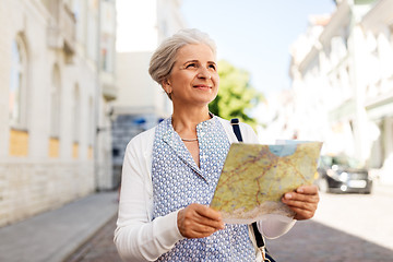 Image showing senior woman or tourist with map on city street