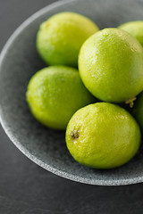 Image showing close up of whole limes in bowl