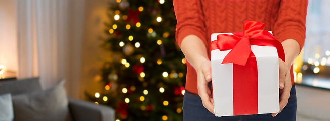 Image showing close up of woman hands holding christmas gift