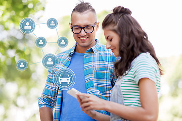 Image showing happy couple using car sharing app on smartphone