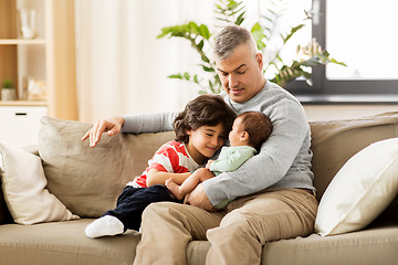 Image showing happy father with preteen and baby son at home