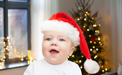 Image showing close up of little baby in santa hat on christmas