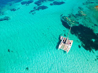 Image showing Drone aerial view of catamaran sailing boat in Maddalena Archipelago, Sardinia, Italy.