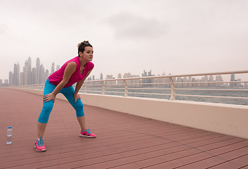 Image showing woman stretching and warming up