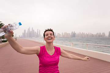 Image showing young woman celebrating a successful training run