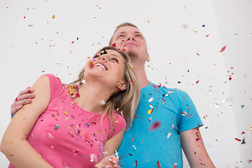 Image showing romantic young  couple celebrating  party with confetti