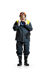 Image showing The studio shot of senior bearded male miner standing at the camera on a white background.