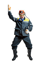 Image showing The studio shot of senior bearded male miner standing at the camera on a white background.