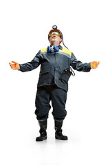 Image showing The studio shot of senior bearded male miner standing at the camera on a white background.