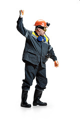 Image showing The studio shot of senior bearded male miner standing at the camera on a white background.