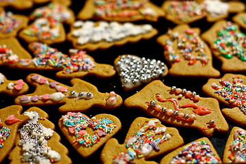 Image showing Homemade christmas cookies on a dark table