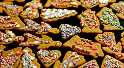 Image showing Homemade christmas cookies on a dark table