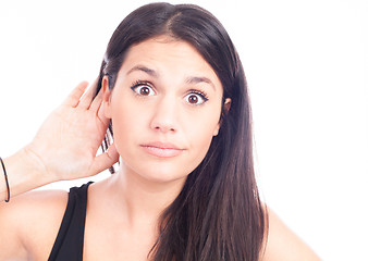 Image showing Young woman trying to listen something