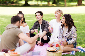 Image showing happy friends with drinks at summer picnic