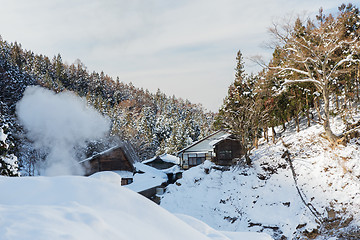 Image showing country houses and forest hills in winter, japan