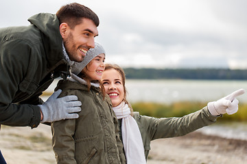 Image showing happy family on autumn beach