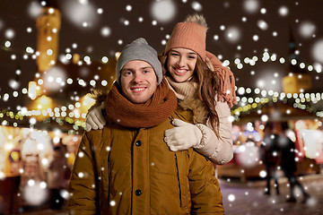 Image showing happy couple hugging at christmas market