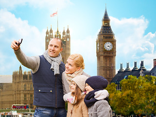 Image showing family taking selfie by smartphone in london city