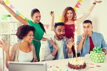 Image showing office team greeting colleague at birthday party