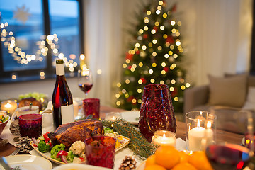 Image showing food and drinks on christmas table at home