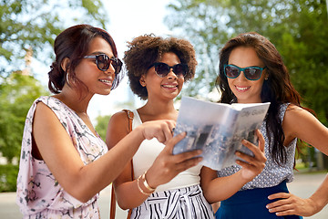 Image showing happy women with city guide on street in summer