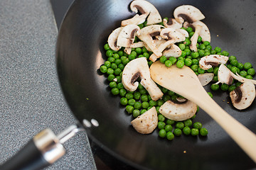 Image showing close up of food in frypan on cooking panel