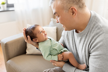 Image showing happy father with little baby boy at home