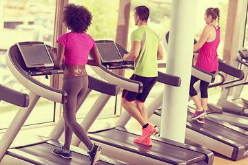 Image showing people exercisinng a cardio on treadmill