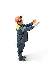 Image showing The studio shot of senior bearded male miner standing at the camera on a white background.