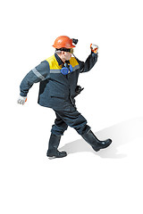 Image showing The studio shot of senior bearded male miner standing at the camera on a white background.