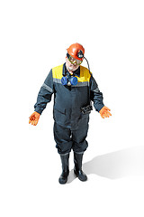 Image showing The studio shot of senior bearded male miner standing at the camera on a white background.